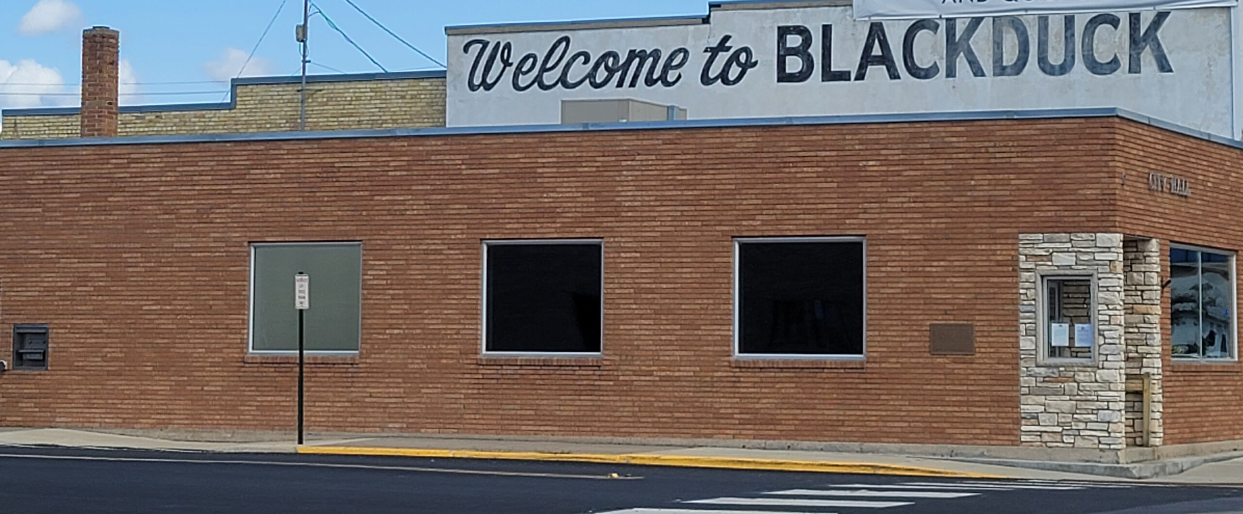 Blackduck City Hall with Welcome to Blackduck sign